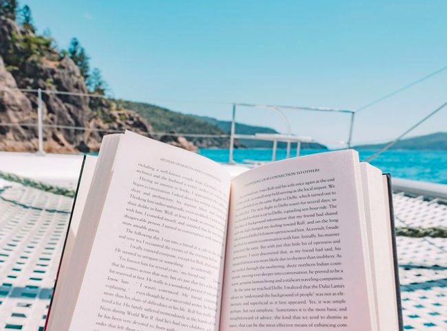 Sunbaking and reading book.Photo credit @isail_whitsundays Instagram