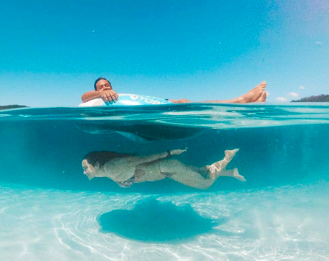 swimming in Fraser. Credits to @ dingosfraserisland on instagram